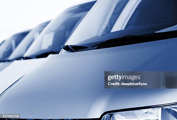 blue metallic vans in a row at dealership - entourage stock pictures, royalty-free photos & images