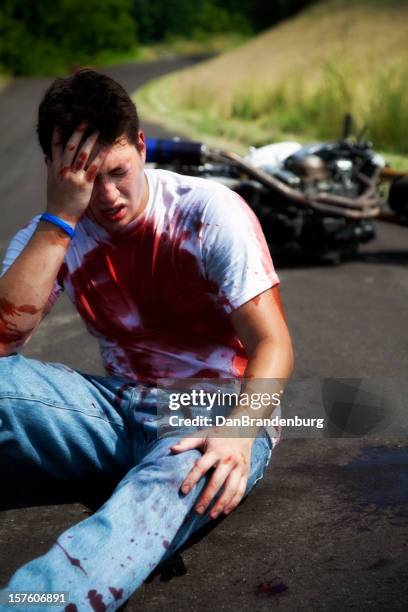 injured biker - street racing stock pictures, royalty-free photos & images