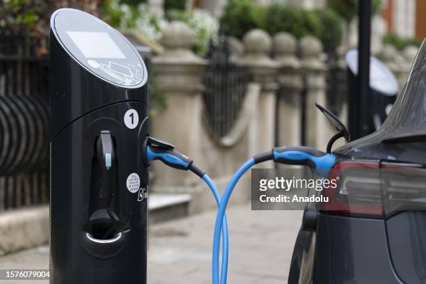 An electric car is charging at the Ultra Low Emissions Zone in London, United Kingdom on August 04, 2023. The Ultra Low Emission Zone implemented in...