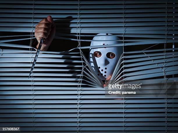 psychopath behind blinds. - psychopathy stock pictures, royalty-free photos & images