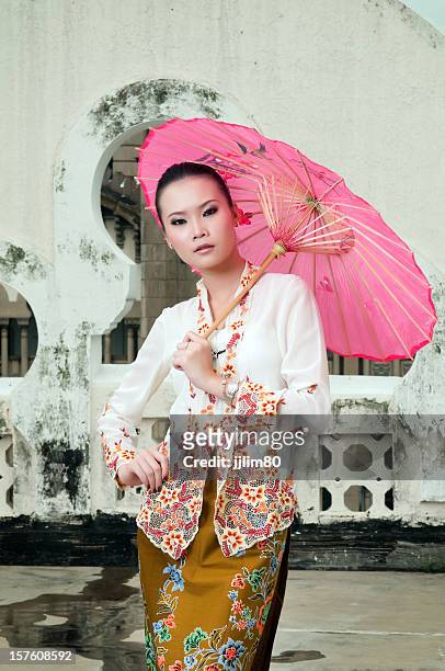the peranakan fashion - baba nyonya and kebaya. - peranakan culture stock pictures, royalty-free photos & images