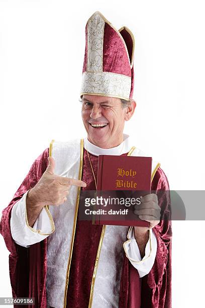 winking priest with a bible - pope stock pictures, royalty-free photos & images