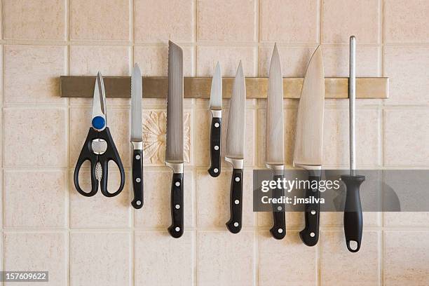 kitchen knives magnetized on the backsplash - kitchen knife stock pictures, royalty-free photos & images