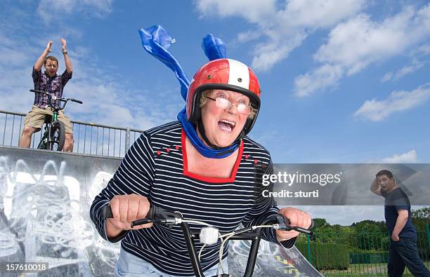 bmx granny - stunt person stock pictures, royalty-free photos & images