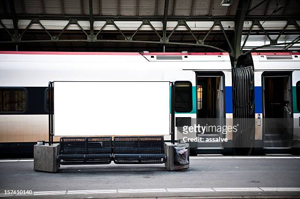 blank billboard in a train station - railwaystation stockfoto's en -beelden