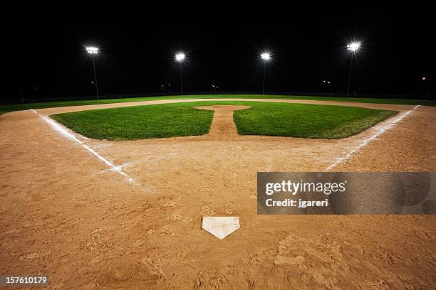 baseball diamond view from home base looking out to field - baseball diamond stock pictures, royalty-free photos & images
