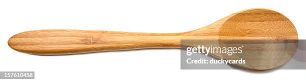 wooden spoon on white background - wooden spoon stock pictures, royalty-free photos & images
