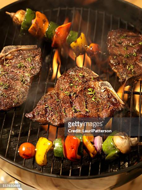 porterhouse steaks with vegetable skewers - grill fire meat stock pictures, royalty-free photos & images