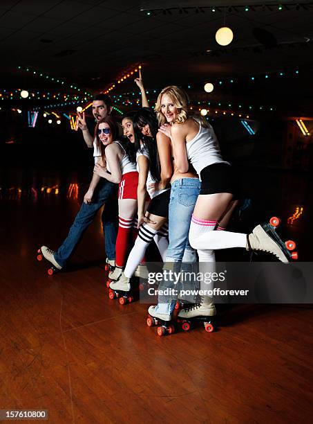 retro 70's roller disco conga line - conga line dancing stock pictures, royalty-free photos & images