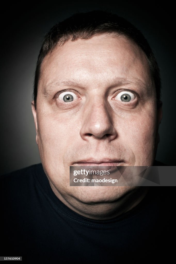 Middle-Aged Man Staring Intently, Studio Portrait