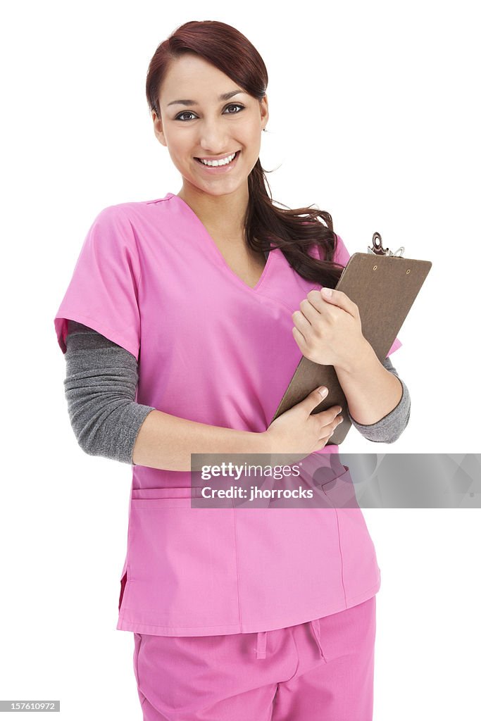 Young Hispanic Nurse in Pink Scrubs with Clipboard