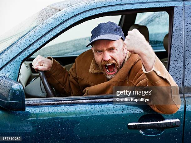 furious male driver shakes his fist out of car window - rage bildbanksfoton och bilder