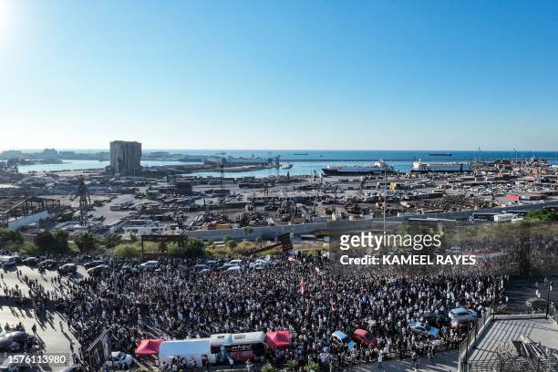 This aerial view shows demonstrators marching outside the port of Beirut on August 4 to mark the third anniversary of the deadly harbour explosion...