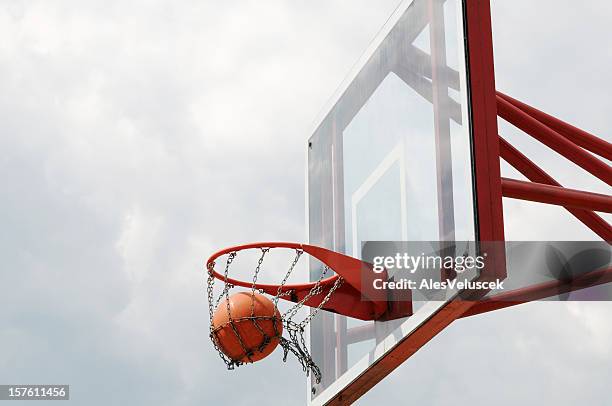 basketball hoop - scoring basketball stock pictures, royalty-free photos & images