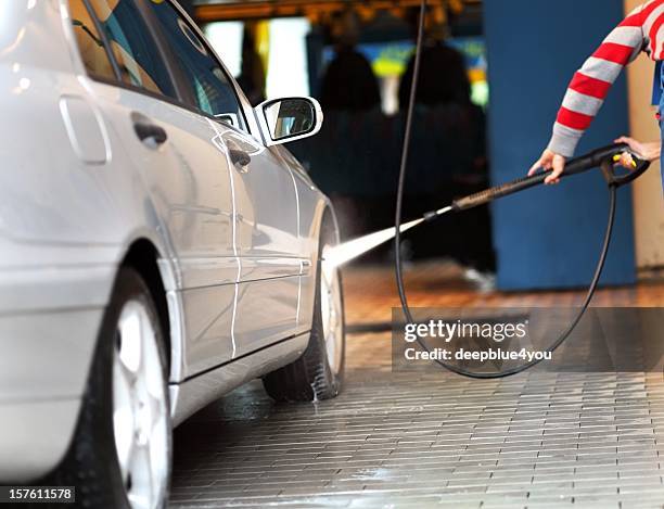 car wash - man with high pressure water jet - service level high stock pictures, royalty-free photos & images