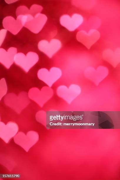 a background of a pink hearts design - bokeh love stock pictures, royalty-free photos & images
