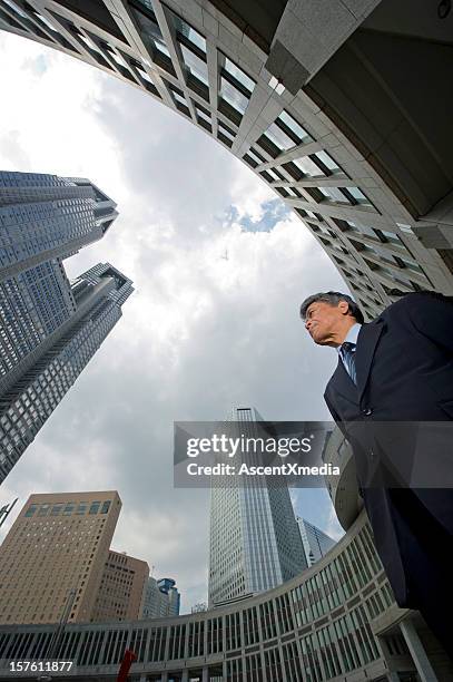 low angle side view of a senior executive man - fine art portrait stock pictures, royalty-free photos & images