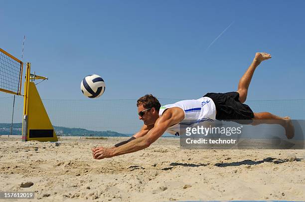 volleyball defensive action - beach volleyball stockfoto's en -beelden
