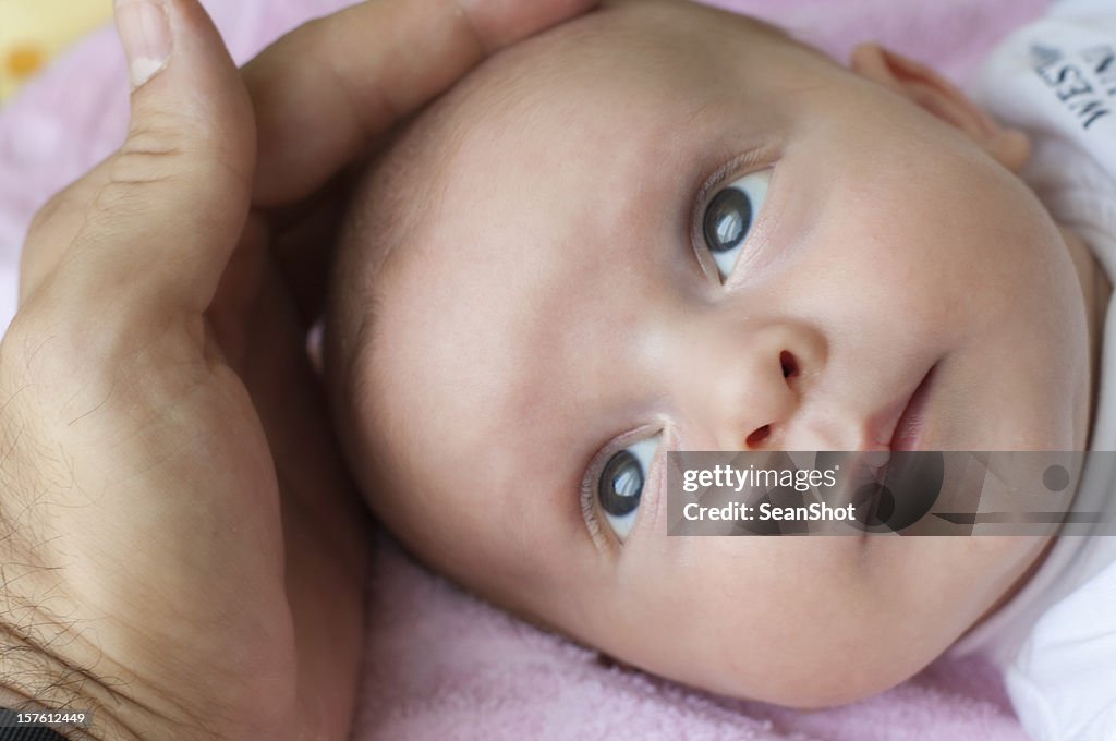 Father stroking Baby