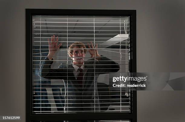 fearful businessman - private view stockfoto's en -beelden