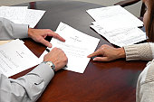 A woman making a formal business agreement signing a will