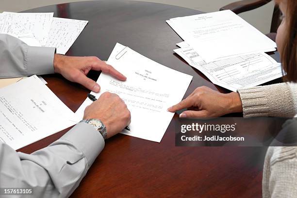 a woman making a formal business agreement signing a will - will stock pictures, royalty-free photos & images