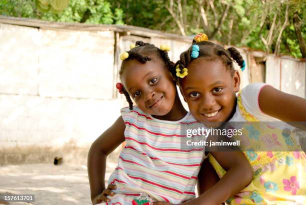 happy girls looking into camera and smiling - caribbean culture stock pictures, royalty-free photos & images