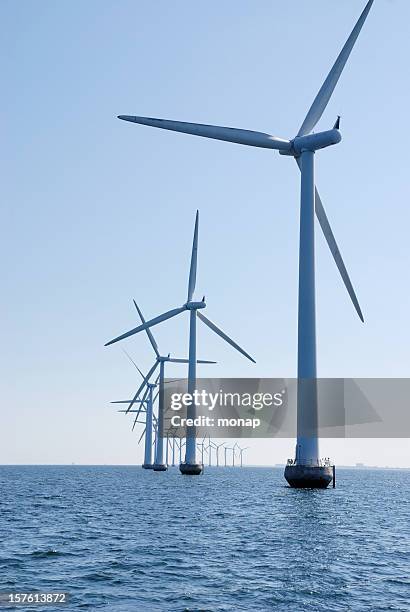 wind turbines at the sea outside copenhagen, vertical - windmill denmark stock pictures, royalty-free photos & images