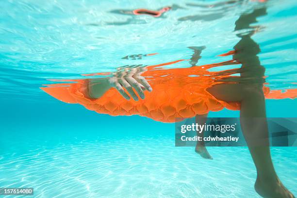 Floatie In Ocean Orange Floatie Photos and Premium High Res Pictures - Getty Images