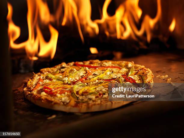 pizza in a wood burning oven - kiln stock pictures, royalty-free photos & images