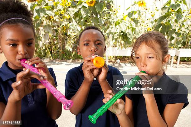 recorder playing - woodwind instrument stock pictures, royalty-free photos & images