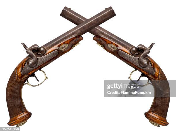 crossed antique pistols isolated on white. - handgun stock pictures, royalty-free photos & images