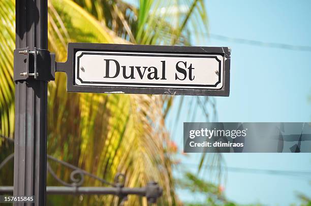 duval street sign in key west florida - key west stock pictures, royalty-free photos & images