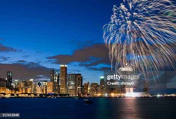 fireworks exploding over chicago waterfront - aon center chicago stock pictures, royalty-free photos & images