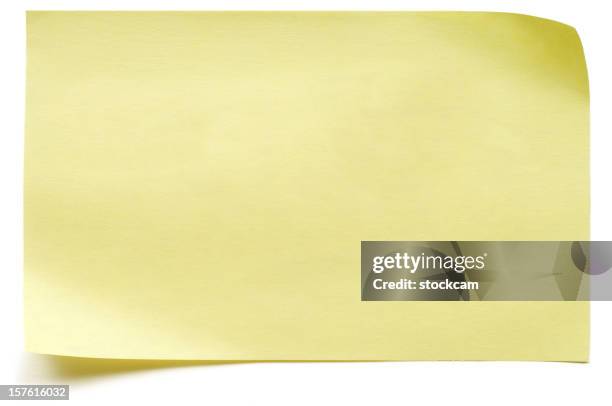 yellow isolated post-it note - plaknotitie stockfoto's en -beelden