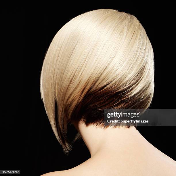 rear view of woman with two-toned hairstyle. black background. - blonde hair black background stock pictures, royalty-free photos & images