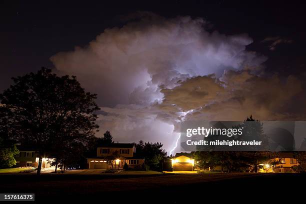 thunderhead and lightning over denver homes - lightning home stock pictures, royalty-free photos & images