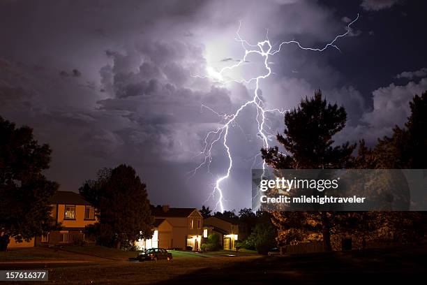 lightning bolt and thunderhead storms over denver neighborhood homes - åskväder bildbanksfoton och bilder