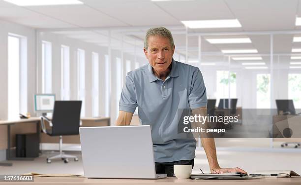 casually dressed mature businessman - grey polo shirt stock pictures, royalty-free photos & images