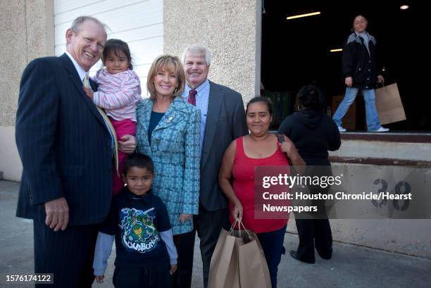 Jack Sweeney carries Guadalupe Chavez Jesus Chavez Sheridan Williams and husband John Eddie Williams, Jr., and Maria Chavez are photographed outside...