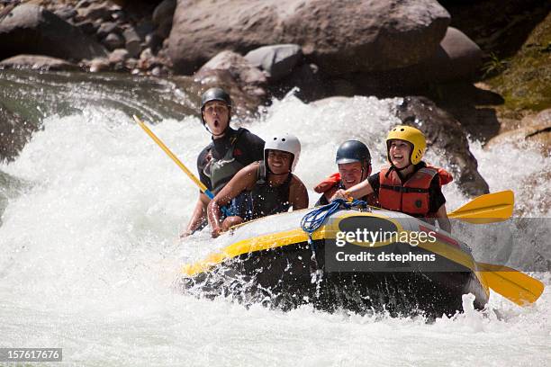 whitewater rafting through rapids - white water rafting stock pictures, royalty-free photos & images