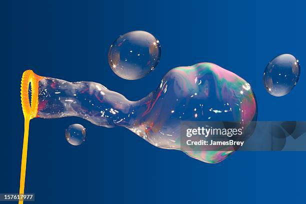 bubble wand and big bubbles - soap stockfoto's en -beelden