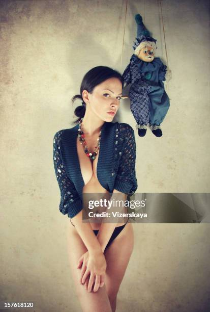 the girl with a doll - puppet on a string stock pictures, royalty-free photos & images