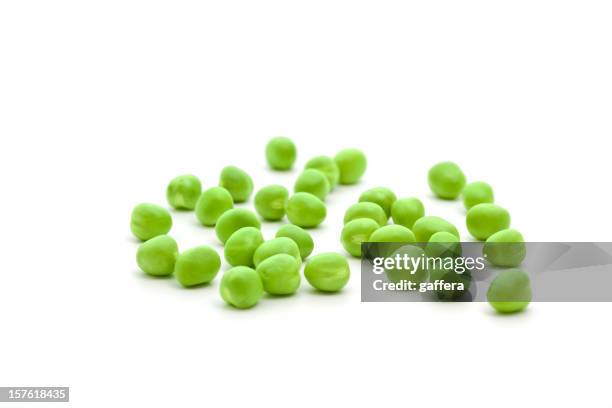 single fresh green peas isolated on a white background - peas stock pictures, royalty-free photos & images