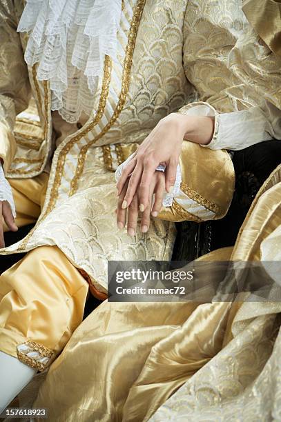 holding hands in ancient costumes - france costume stockfoto's en -beelden