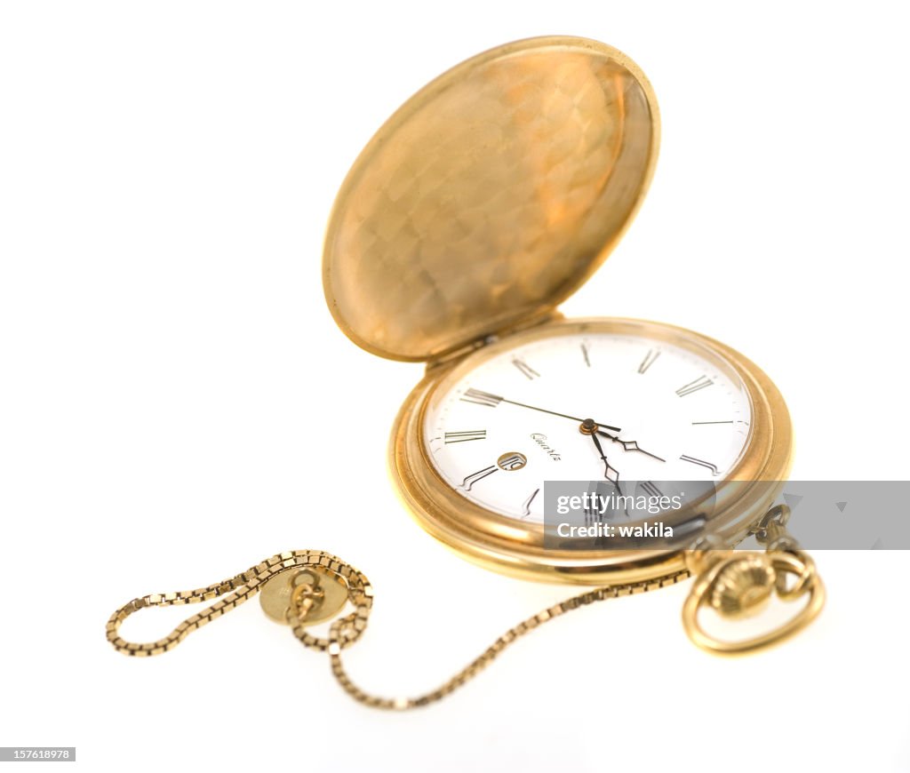 Golden pocket watch isolated on white