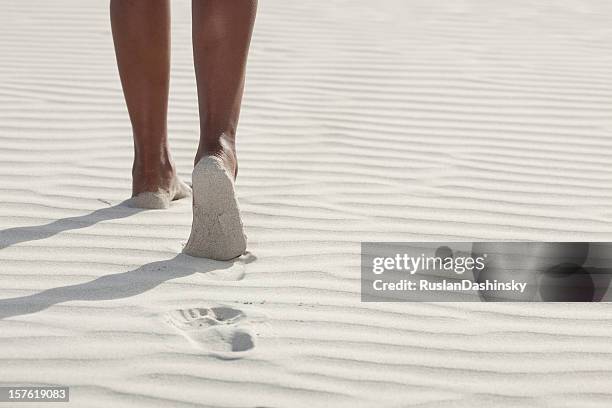 walking on a white sand beach. - feet direction stock pictures, royalty-free photos & images