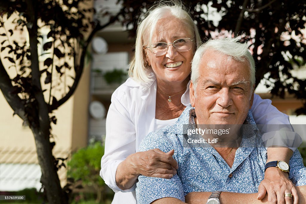 Senior couple hugging in the park