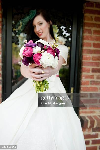 bride holding bouquet of ranunculus flowers - ranunculus wedding bouquet stock pictures, royalty-free photos & images