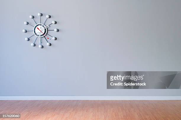 retro wall clock in empty room - wainscoting stock pictures, royalty-free photos & images